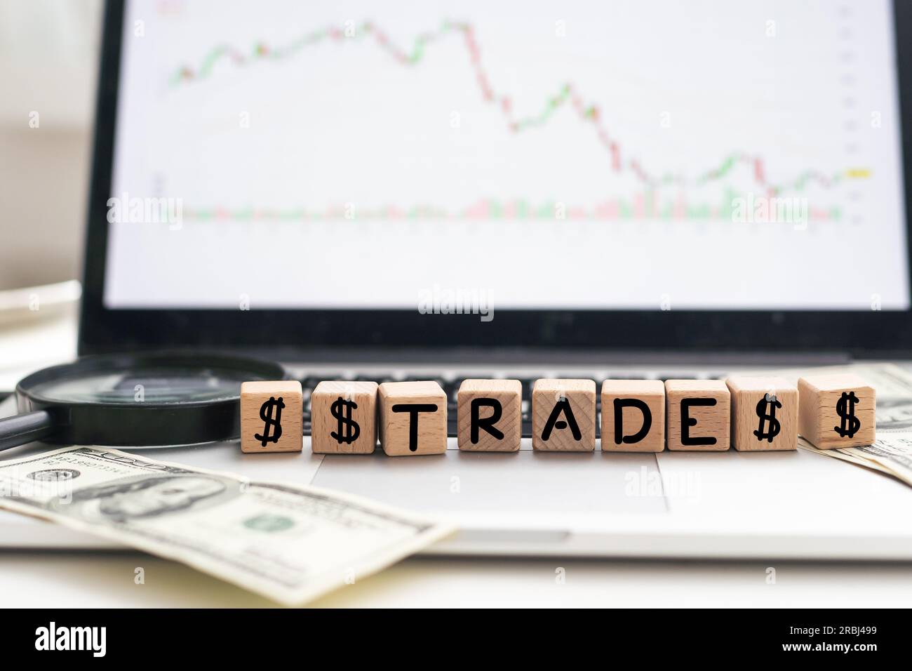 the word TRADER written in wooden block letters Stock Photo - Alamy