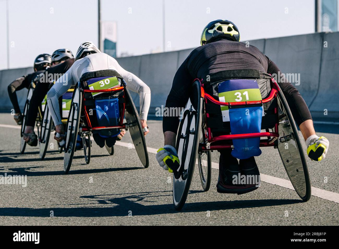 close-up group para athlete in wheelchair racing marathon race, sports summer games para athletics Stock Photo