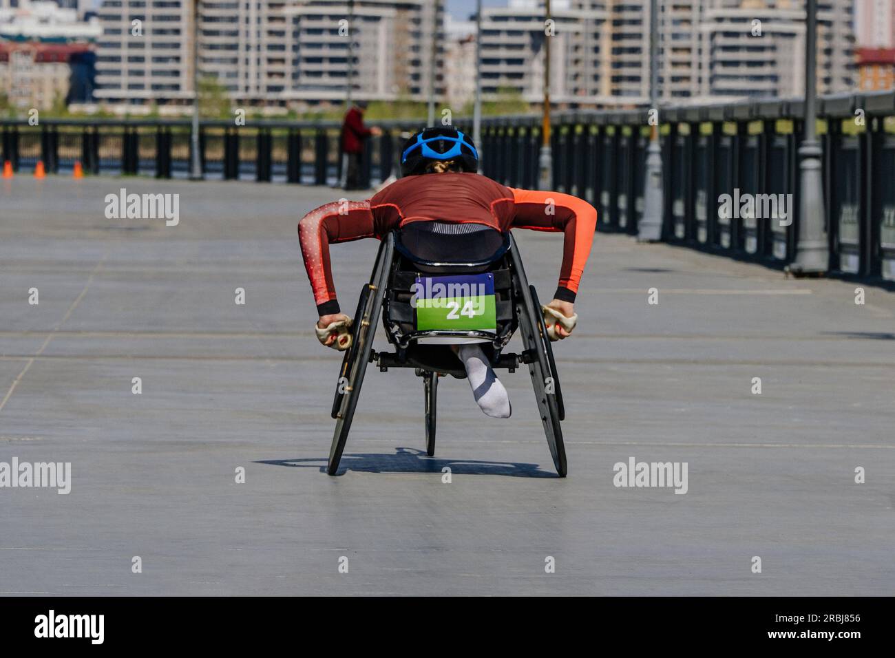 female para athlete in wheelchair racing marathon race, sports summer games para athletics Stock Photo