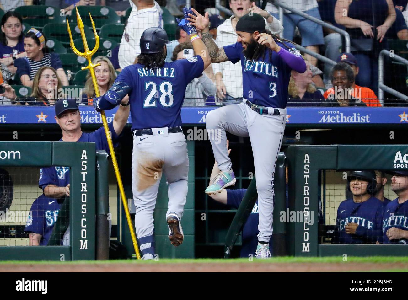 Seattle Mariners' J.P. Crawford holds a trident after hitting a