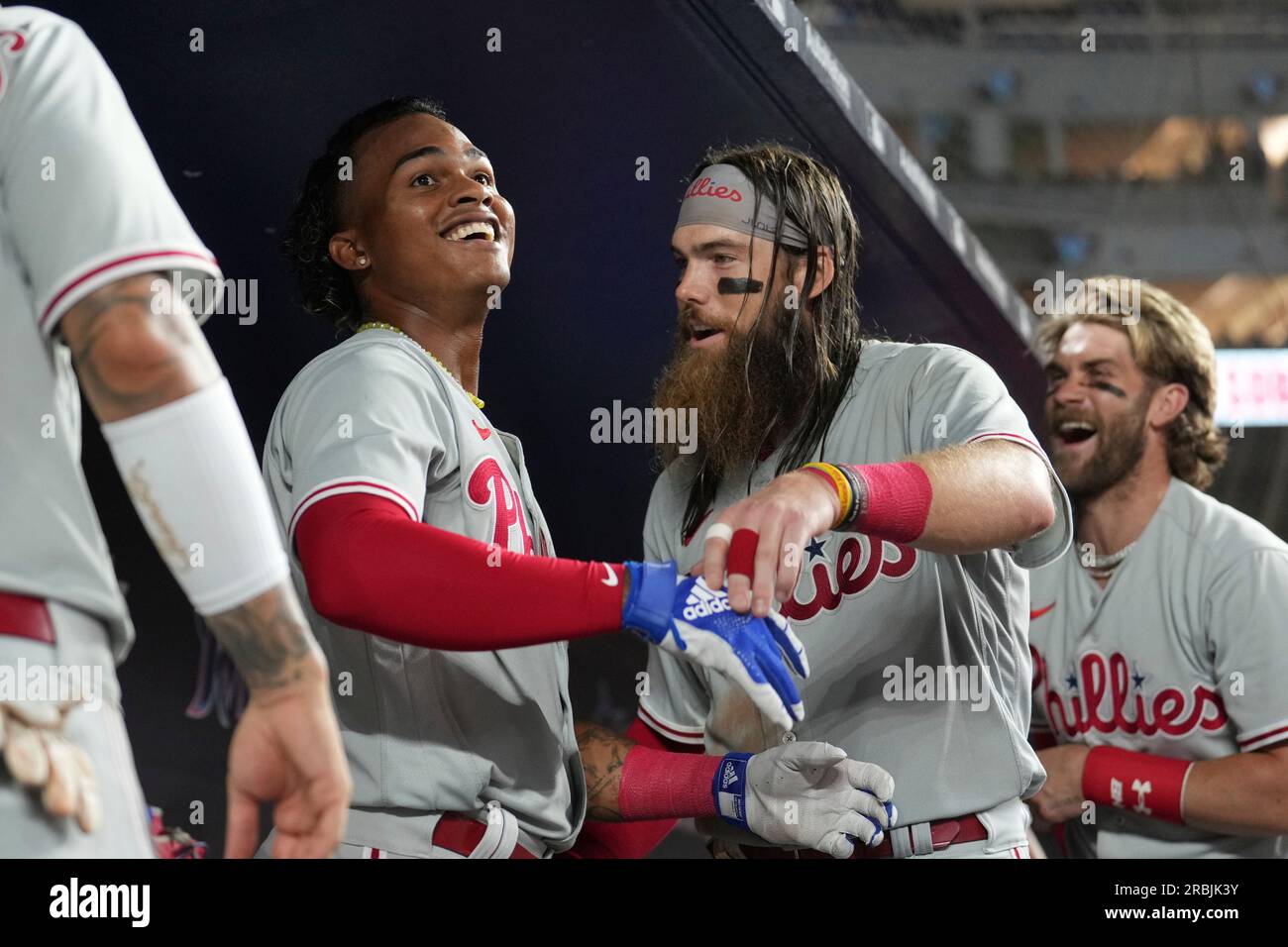 Philadelphia Phillies' Brandon Marsh smiles at Alec Bohm (28