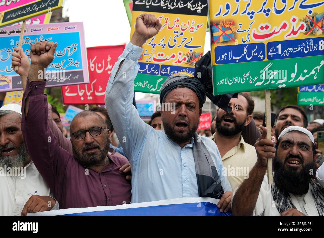 Muslim protestors chant slogans during a rally to denounce burning of ...