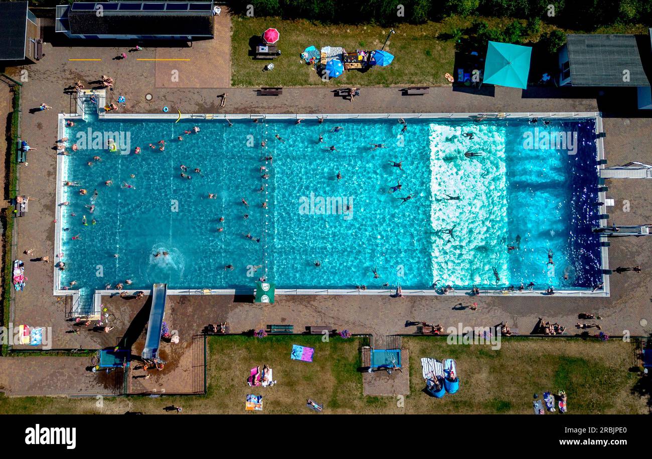 People spend time in a public pool in Wehrheim near Frankfurt, Germany, on  a hot Saturday, July 8, 2023. (AP Photo/Michael Probst Stock Photo - Alamy