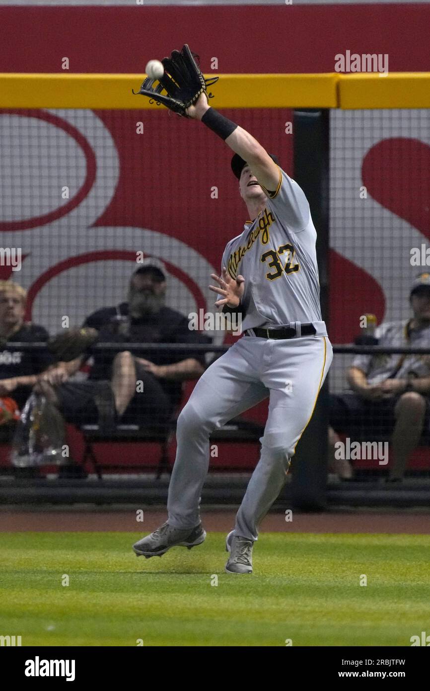 Pittsburgh Pirates center fielder Jack Suwinski looks out of the dugout  before the start of a baseball game against the Miami Marlins, Friday, June  23, 2023, in Miami. (AP Photo/Wilfredo Lee Stock