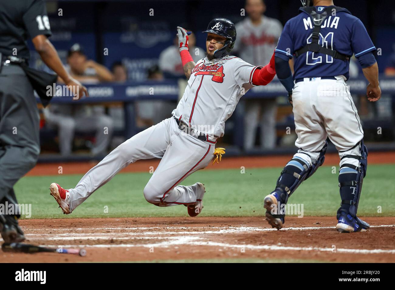 Atlanta Braves' Orlando Arcia, center, slides in to score behind Tampa Bay  Rays catcher Francisco Mejia, right, during the ninth inning of a baseball  game Saturday, July 8, 2023, in St. Petersburg,