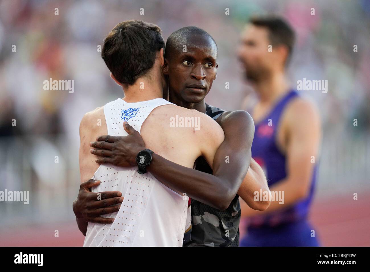 Second place finisher Benard Keter, facing, congratulates winner ...