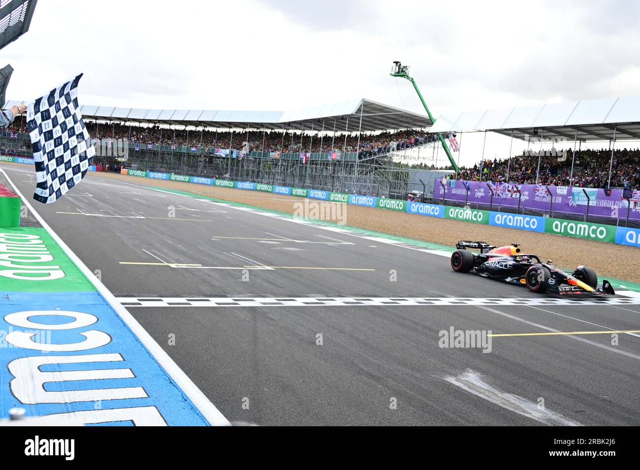 Red Bull driver Max Verstappen of the Netherlands crosses the finish ...