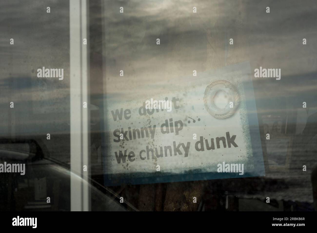 Sign saying 'We don't skinny dip, we chunky dunk' Stock Photo