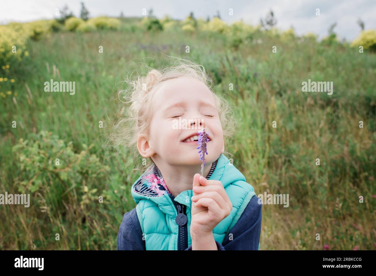 Child smelling food or flower hi-res stock photography and images - Alamy