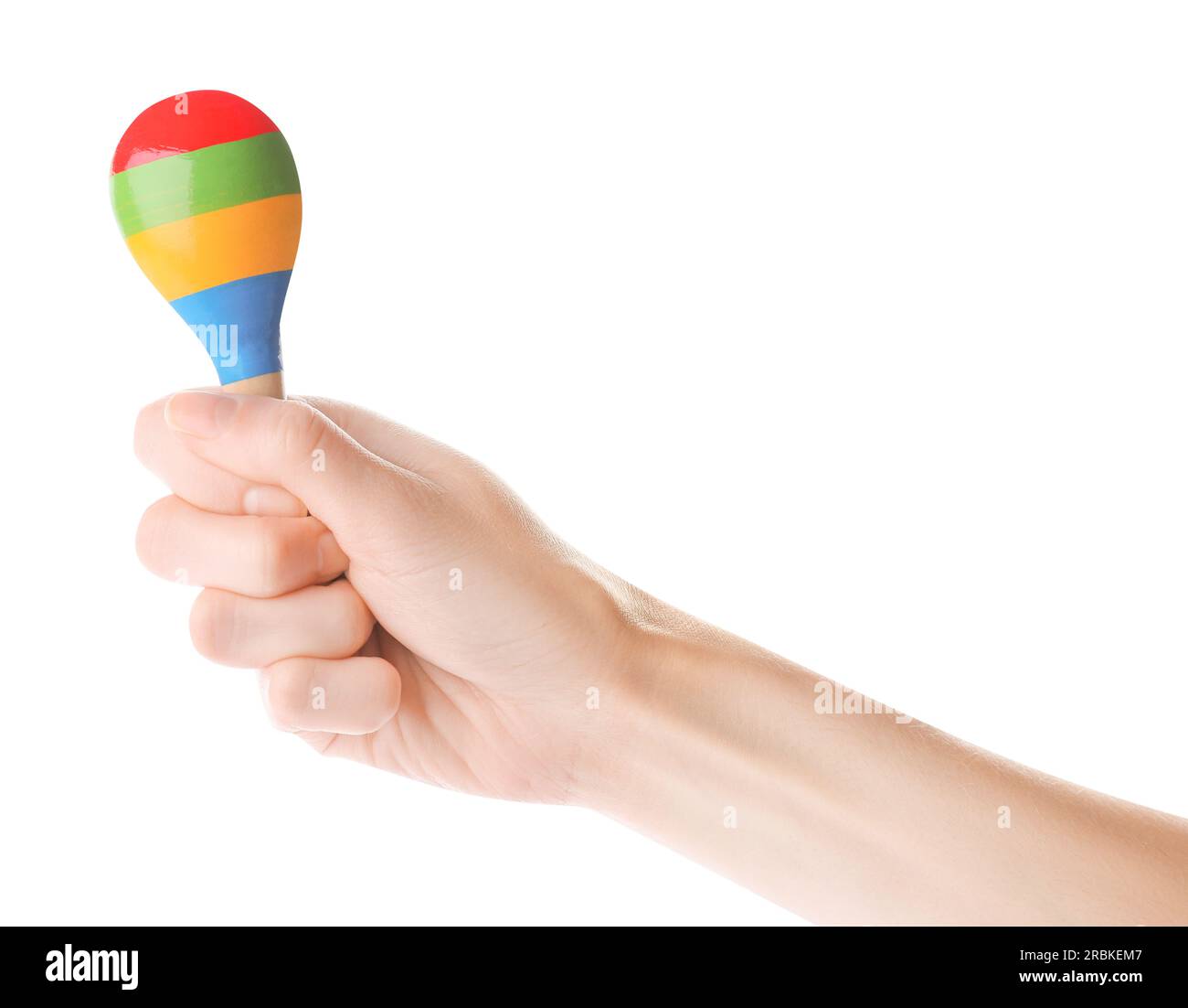 Woman holding colorful maraca on white background, closeup. Musical instrument Stock Photo