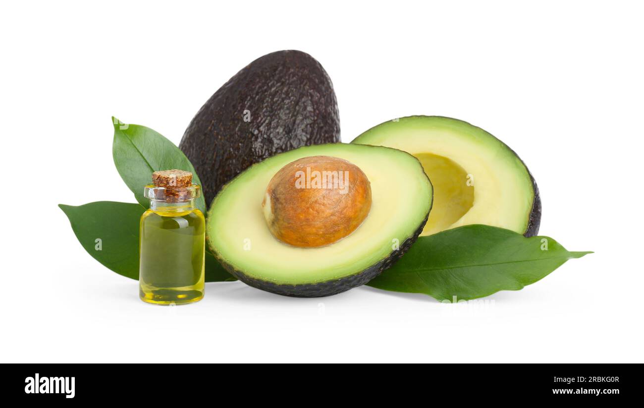 Bottle of oil and fresh avocados on white background Stock Photo Alamy