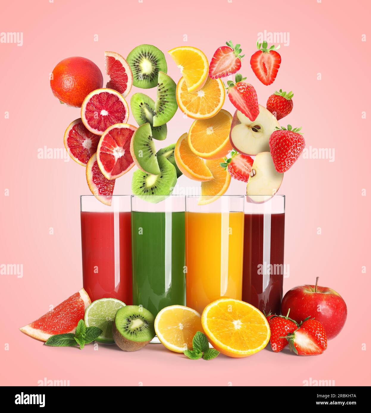 Different types of juices and fresh fruits on pink background Stock