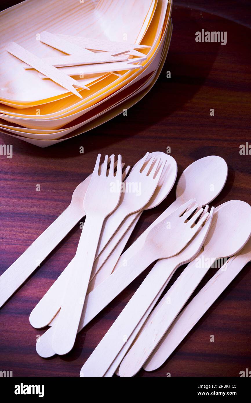 Eco-friendly wooden dishes and cutlery Stock Photo - Alamy