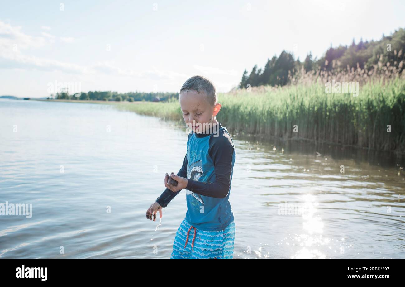 Young boy playing sand hi-res stock photography and images - Alamy