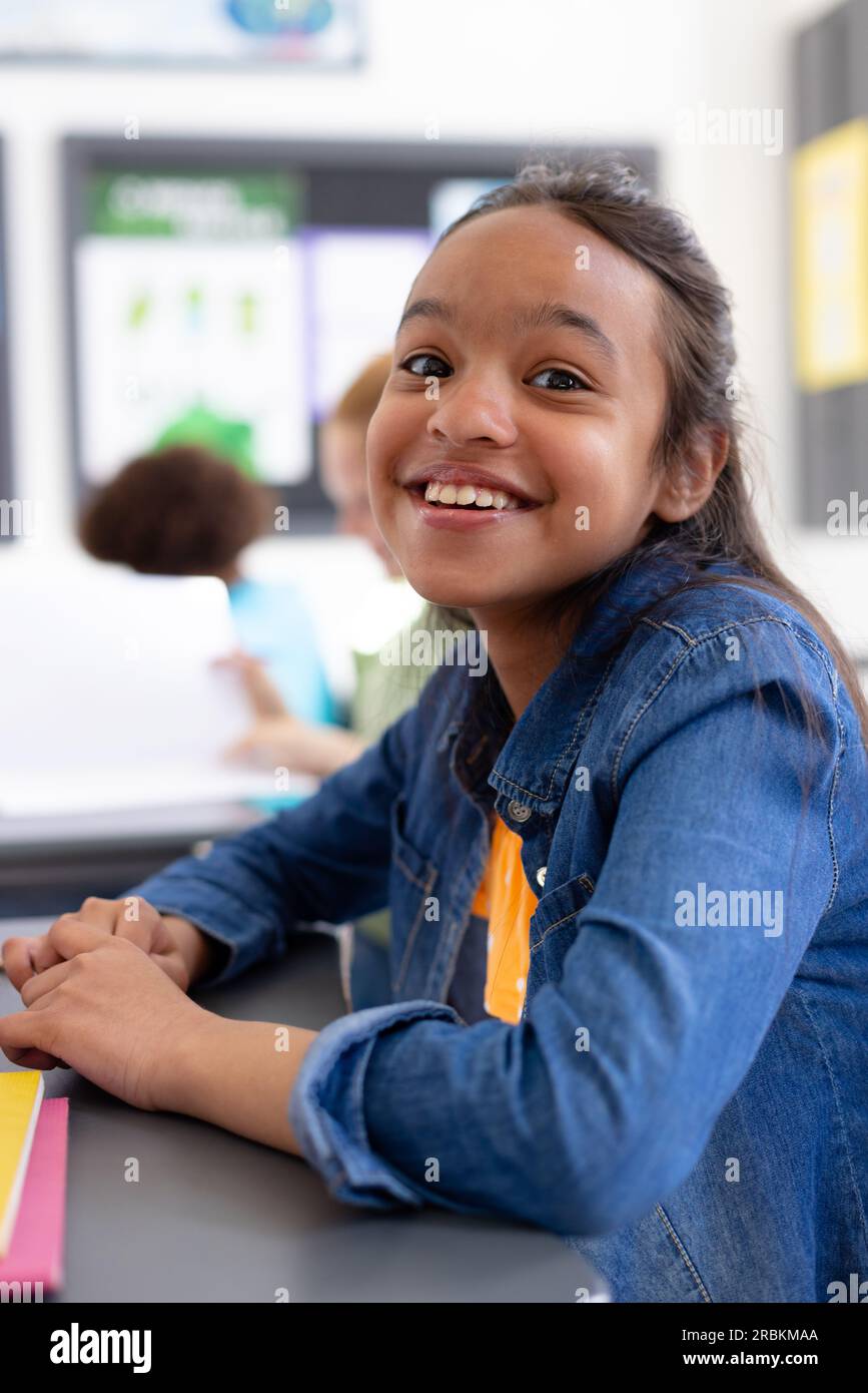 Young schoolgirl sitting school hi-res stock photography and images - Alamy