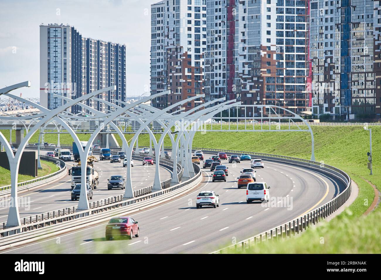 Russia, St.Petersburg, 07 July 2023: Expressway of the western high-speed diameter in clear sunny weather, green lawns along the road, new colourful Stock Photo