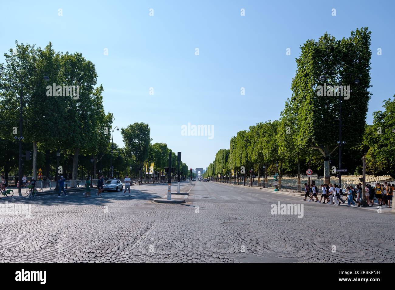 Paris, France - June 25, 2023 : Panoramic view of the Avenue Champs Élysée and the Arc de Triomphe, the Triumphal Arch of the star in the background Stock Photo