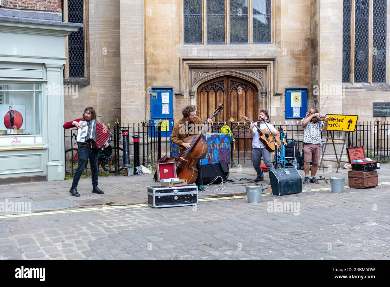 Buskers on the streets of York UK, buskers, street buskers, street band, playing for money, musicians, street musicians, York city, UK, England, Stock Photo