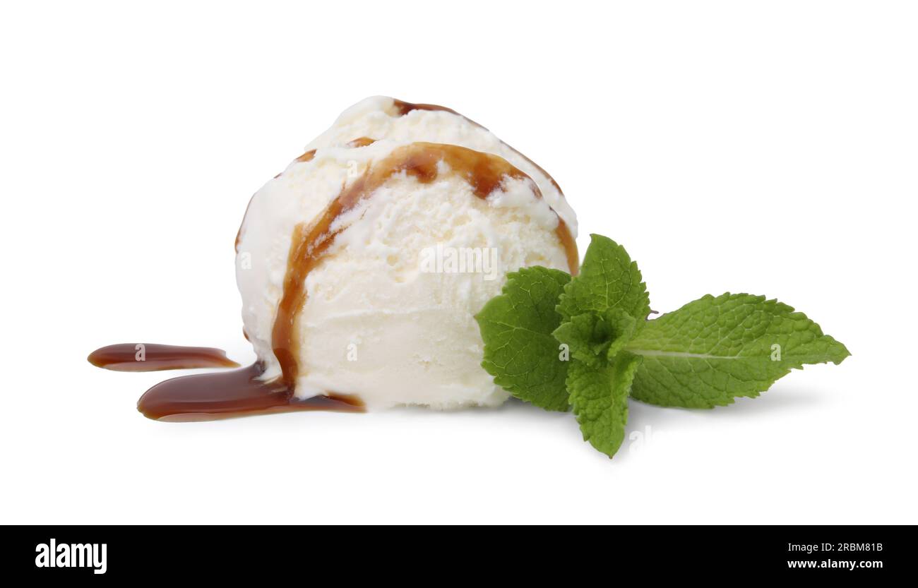 Scoop of ice cream with caramel sauce and mint isolated on white Stock ...
