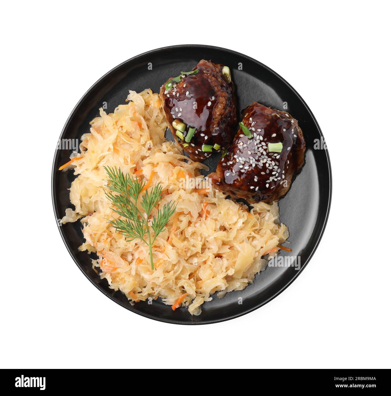 Plate with sauerkraut and chicken isolated on white, top view Stock