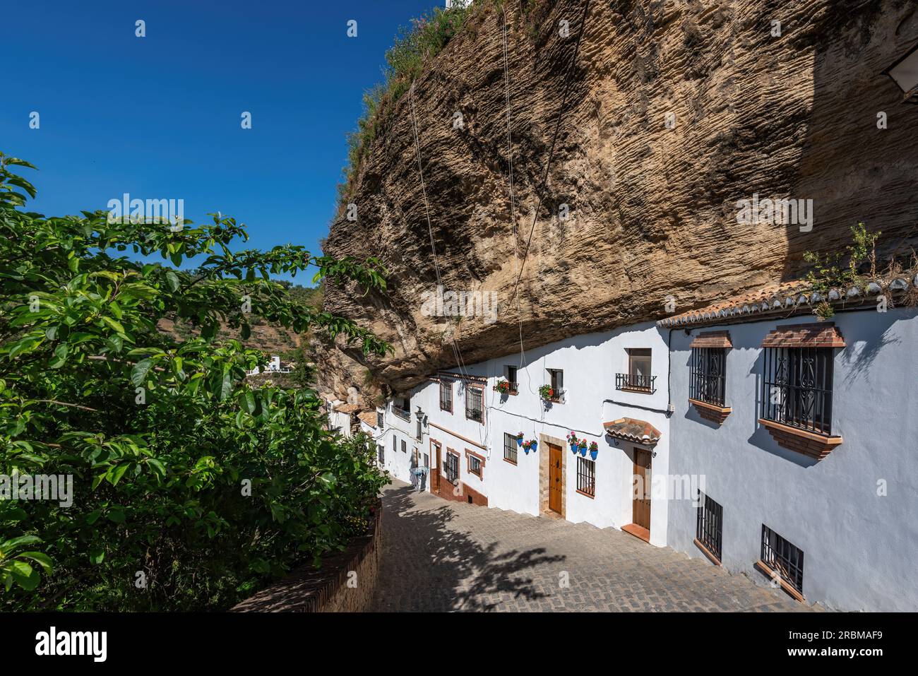 Calle Calcetas Street with Rocks dwellings - Setenil de las Bodegas, Andalusia, Spain Stock Photo