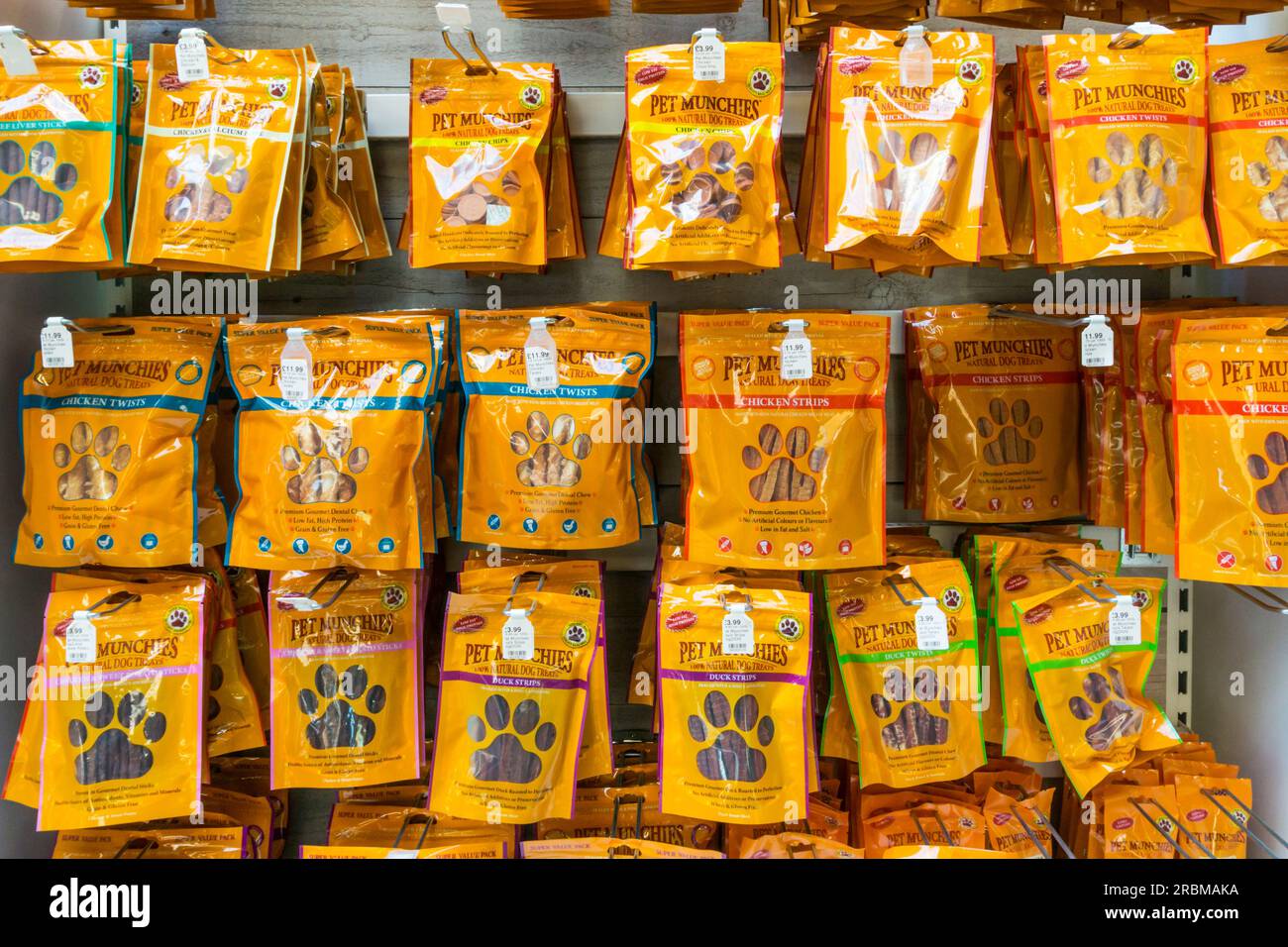 Packets of Pet Munchies dog treats for sale. Stock Photo