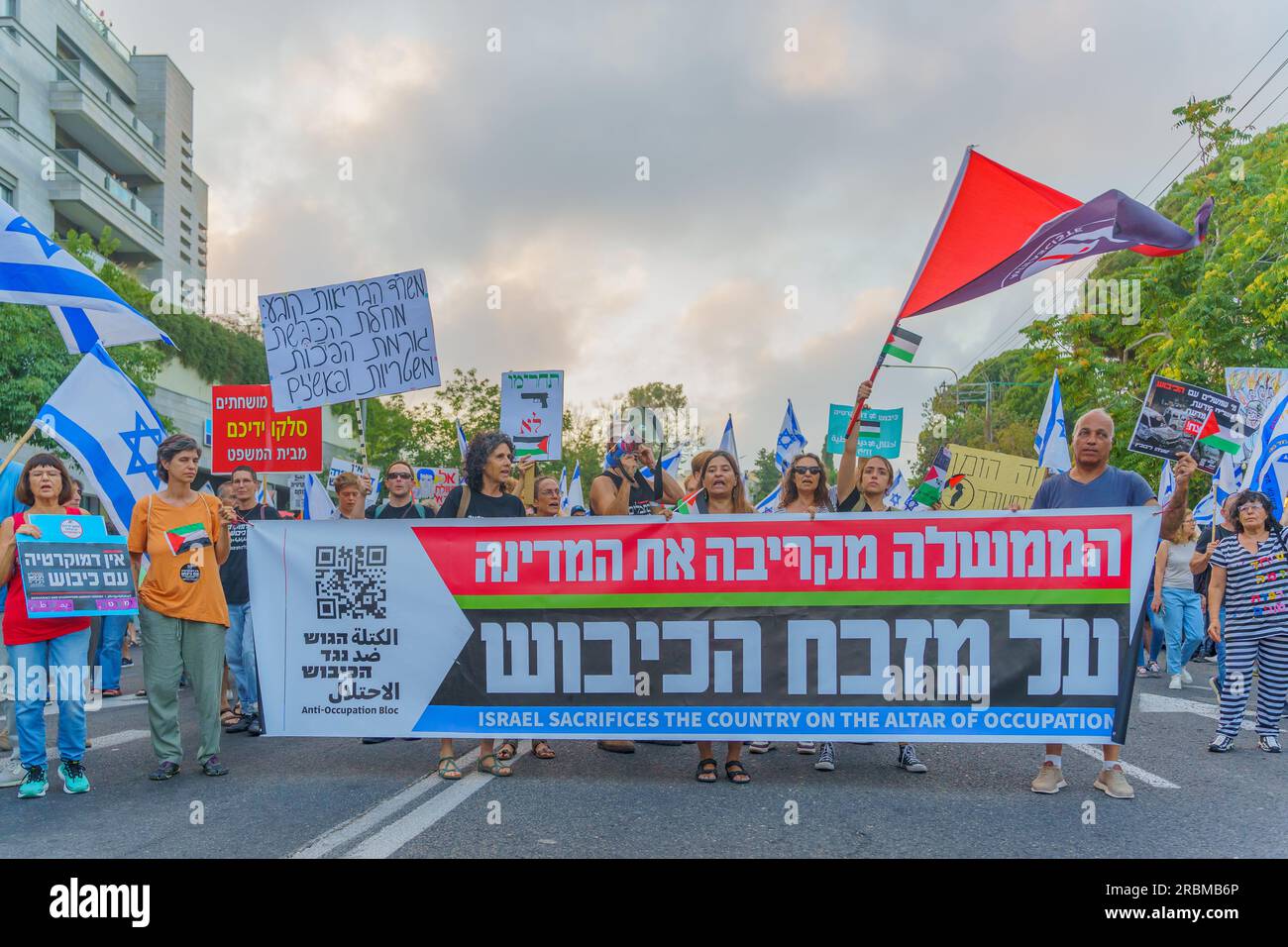 Haifa, Israel - July 08, 2023: Group of people with anti-occupation signs. Week 27 of anti-government protest in Haifa, Israel Stock Photo