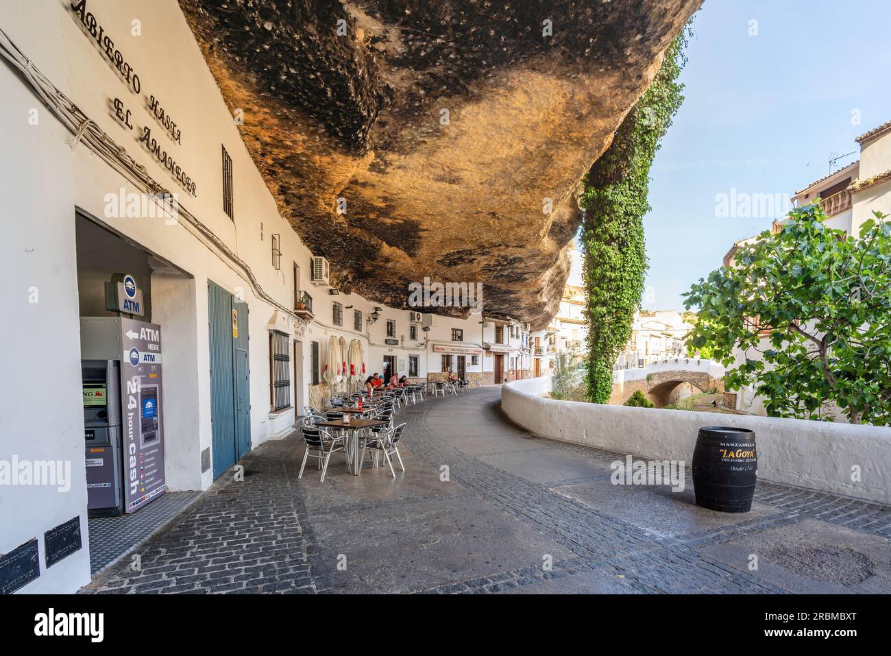 Calle Cuevas del Sol Street with Rocks dwellings and restaurants - Setenil de las Bodegas, Andalusia, Spain Stock Photo