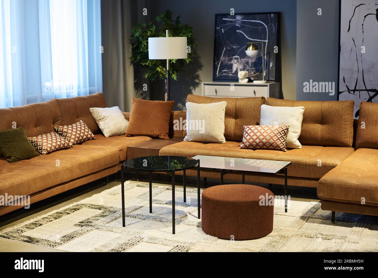 Corner of coworking area with soft comfortable couches with cushions