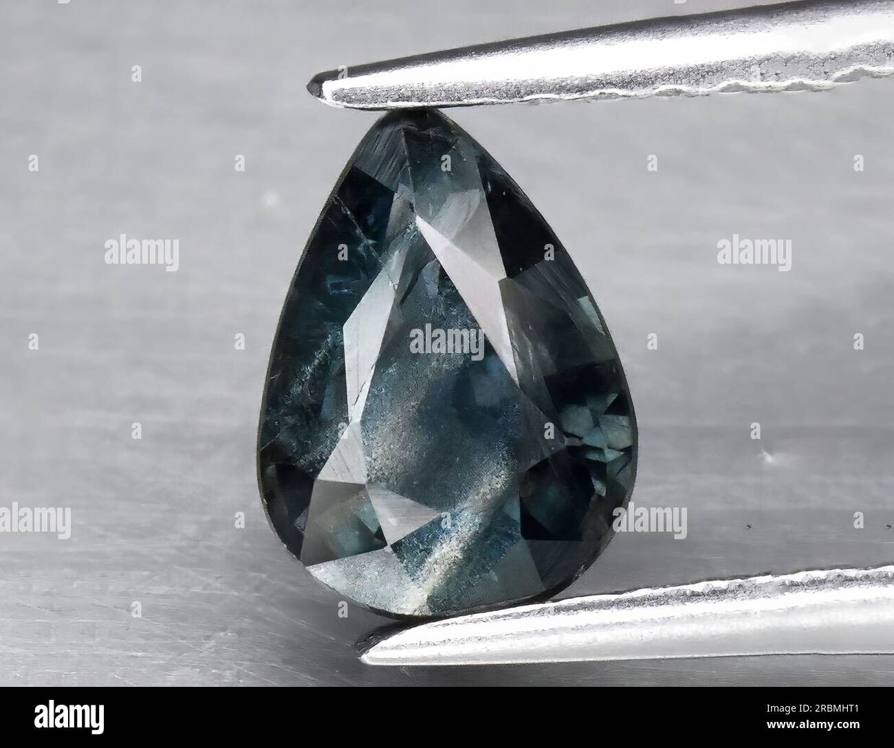 Natural gemstone green blue sapphire on white background Stock Photo ...