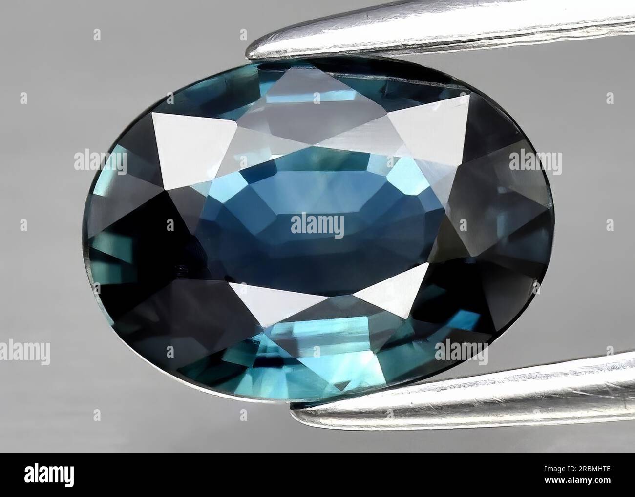 Natural gemstone green blue sapphire on white background Stock Photo ...