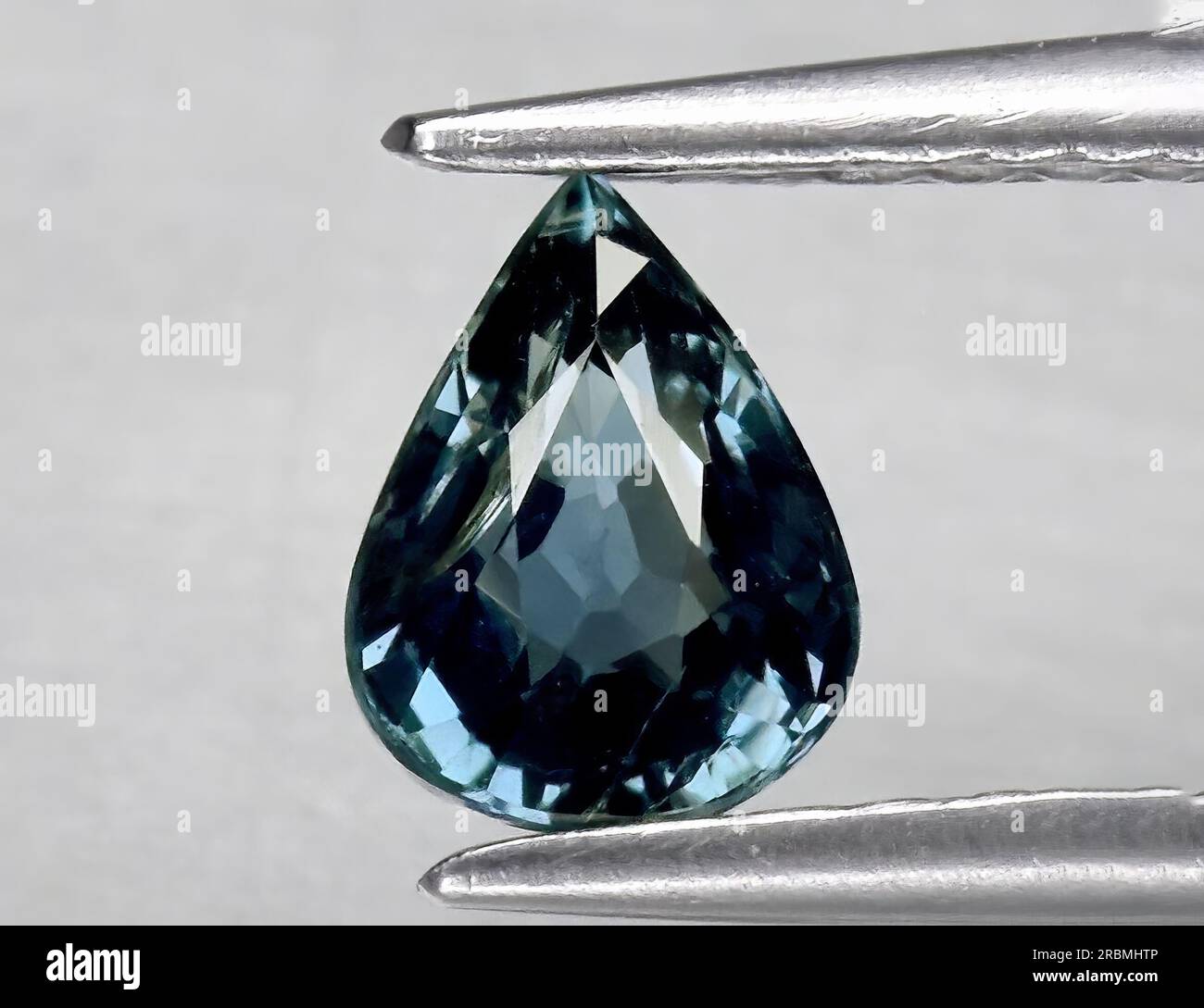 Natural gemstone green blue sapphire on white background Stock Photo ...