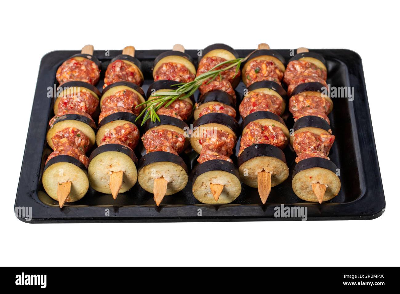 Eggplant kebab. Eggplant shish kebab with raw minced meat isolated on
