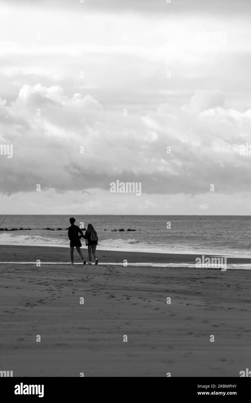 Couple walking on the beach in Ostend, Belgium. Stock Photo