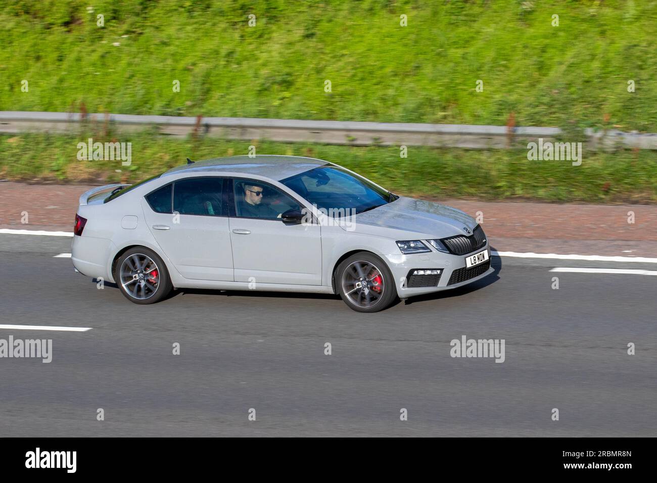 2018 Skoda Octavia Vrs Tdi S-A Tdi 184 DSG Auto Start/Stop Grey Car Hatchback Diesel 1968 cc travelling at speed on the M6 motorway in Greater Manchester, UK Stock Photo
