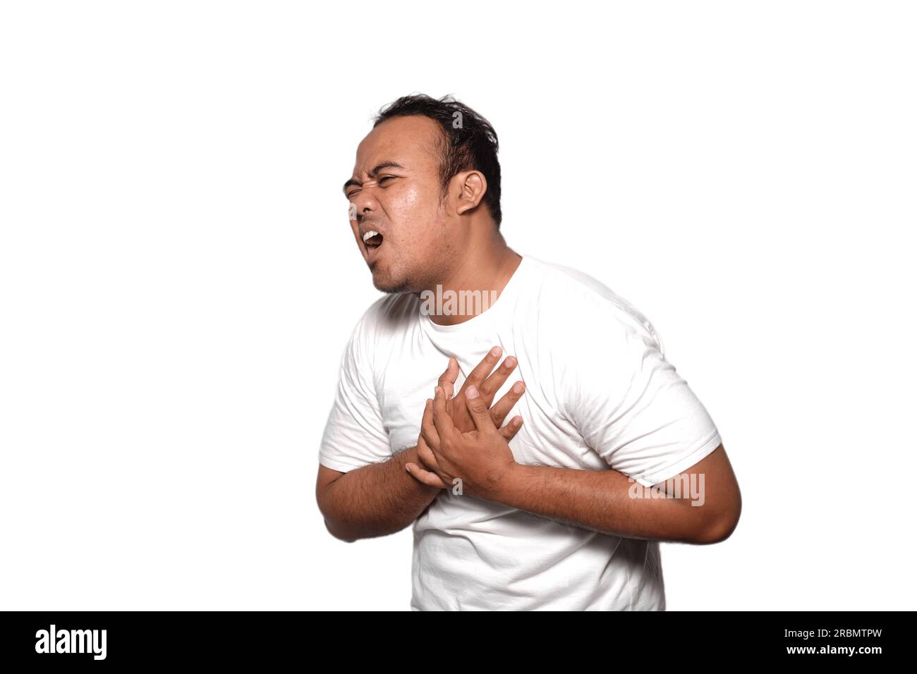 Photo of man asia wearing white tshirt ill, chest pain because Heart attack or broken heart suffers pain isolated on white background Stock Photo