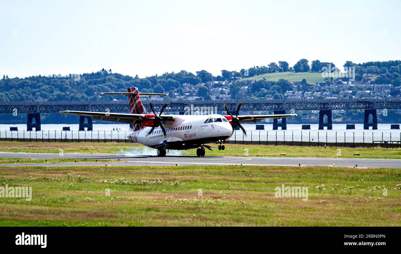 Dundee, Tayside, Scotland, UK. 10th July, 2023. The weather across Tayside, Scotland is bright and warm with temperatures reaching 22°C. Loganair G-LMRD aircraft from London Heathrow arrived on time at 11.30 a.m. The SAAB Loganair twin-prop plane landing at the Dundee Riverside Airport. Credit: Dundee Photographics/Alamy Live News Stock Photo