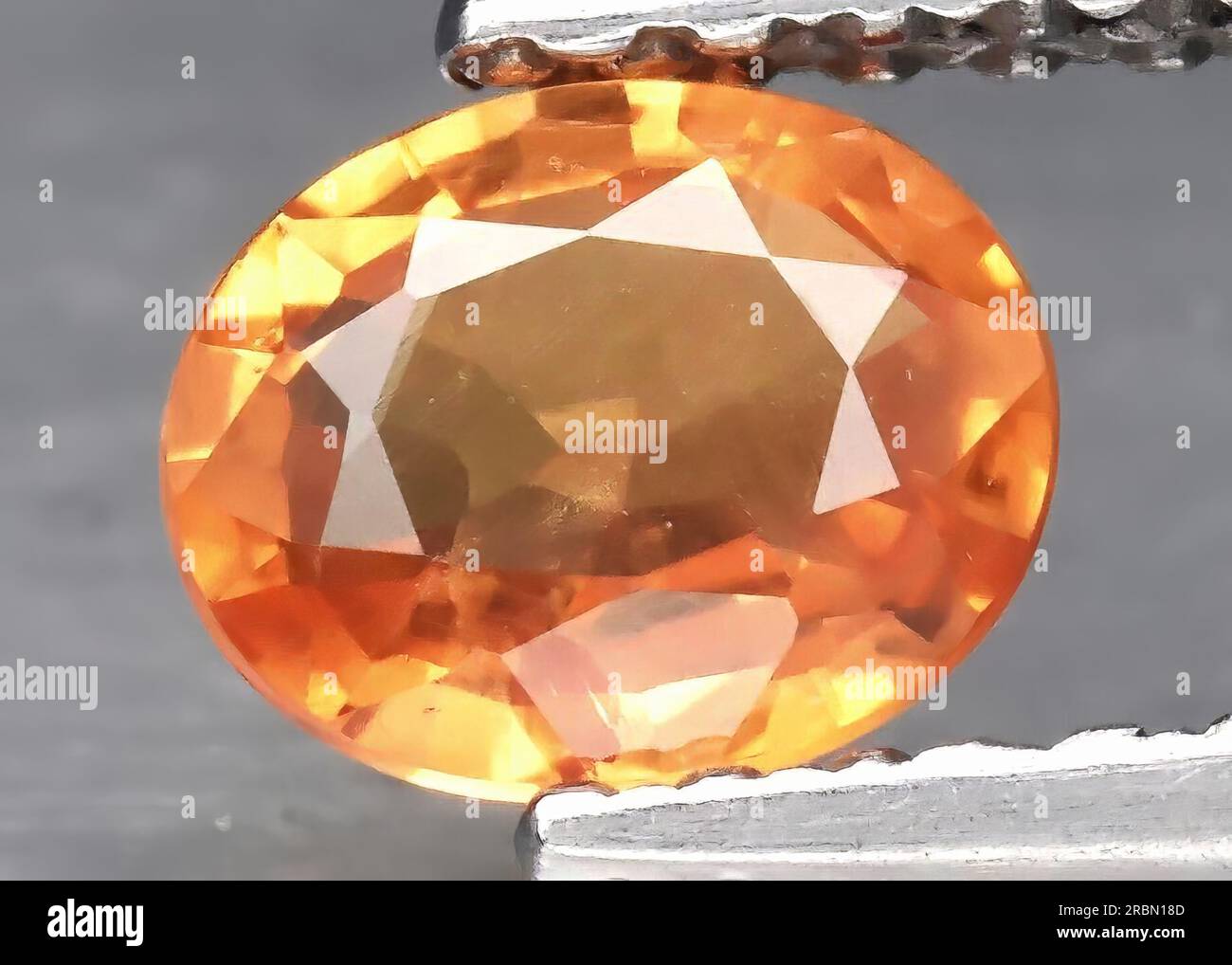 Natural gemstone orange sapphire isolated on white background Stock