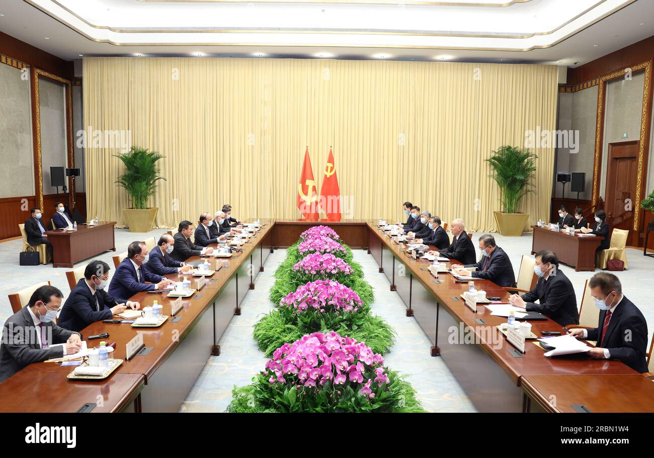 Beijing, China. 10th July, 2023. Cai Qi, a member of the Standing Committee of the Political Bureau of the Communist Party of China (CPC) Central Committee and a member of the Secretariat of the CPC Central Committee, meets with a Communist Party of Vietnam (CPV) delegation headed by Nguyen Xuan Thang, a member of the Politburo of the CPV Central Committee, president of the Ho Chi Minh National Academy of Politics, and chairman of the Central Theoretical Council, in Beijing, capital of China, July 10, 2023. Credit: Wang Ye/Xinhua/Alamy Live News Stock Photo