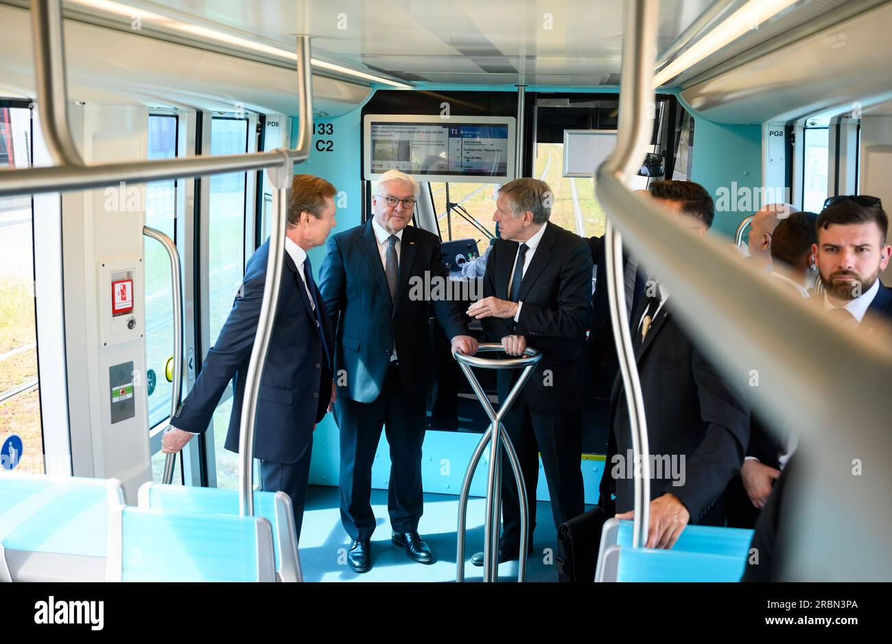 10 July 2023, Luxembourg, Luxemburg: German President Frank-Walter Steinmeier (m) rides a streetcar through Luxembourg City with Grand Duke Henri of Luxembourg (l) and Francois Bausch, Deputy Prime Minister and Minister for Mobility. President Steinmeier and his wife are in Luxembourg for a two-day official visit. Photo: Bernd von Jutrczenka/dpa Stock Photo