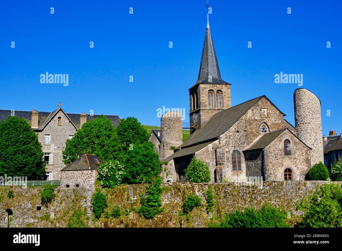 France, Cantal (15), Allanche, Saint-Jean-Baptiste fortified church. Auvergne Volcanoes Regional Nature Park, Cézallier plateau Stock Photo