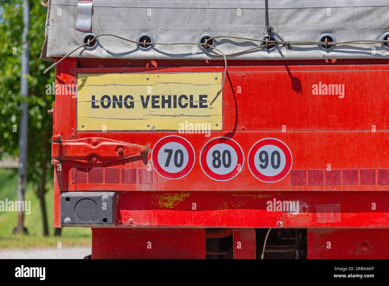 Long Vehicle and Speed Limit Stickers at Cargo Truck Trailer Stock
