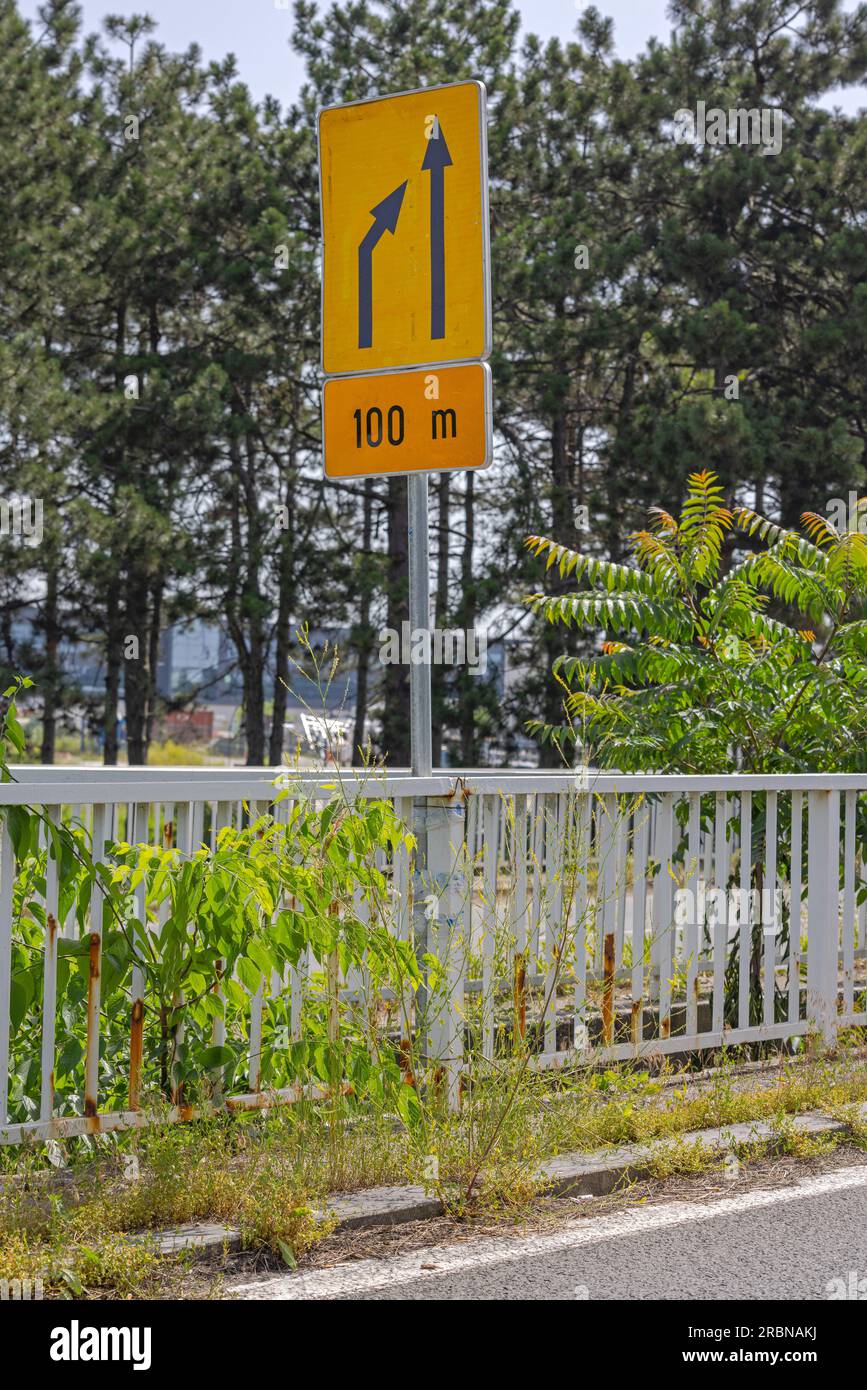 Merge Lane Traffic Ahead Road Sign Caution Stock Photo - Alamy