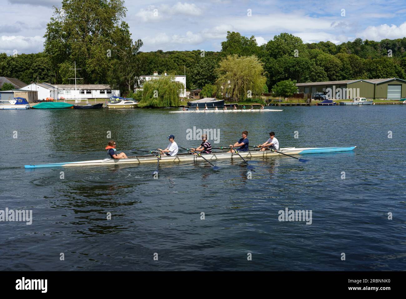 Young members from a rowing club out on the river at Henley on Thames. Stock Photo