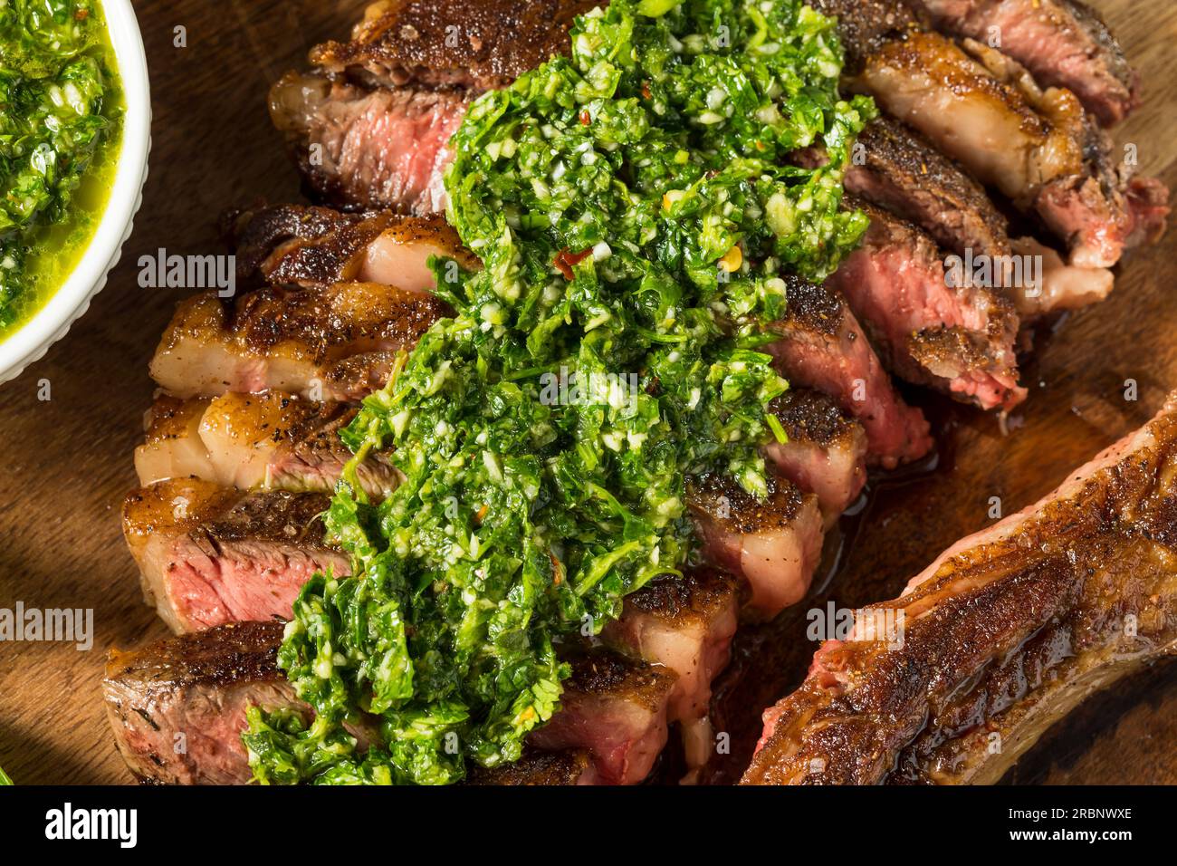 Homemade Chimichurri Sauce and Ribeye Steak with Garlic Stock Photo