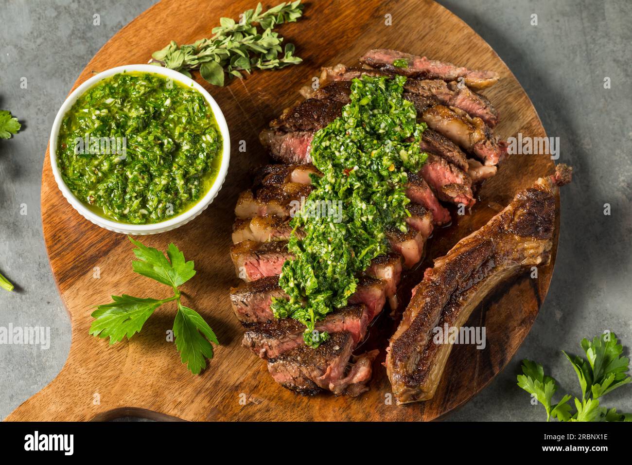 Homemade Chimichurri Sauce and Ribeye Steak with Garlic Stock Photo