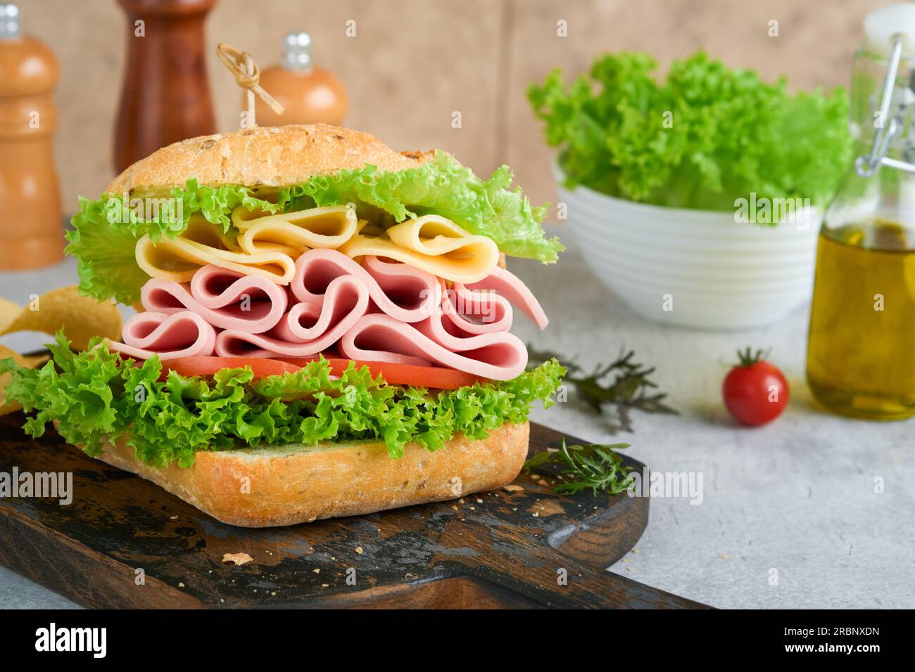 https://c8.alamy.com/comp/2RBNXDN/sandwich-tasty-sandwich-with-ham-or-bacon-cheese-tomatoes-lettuce-and-grain-bread-delicious-club-sandwich-or-school-lunch-breakfast-or-snack-2RBNXDN.jpg