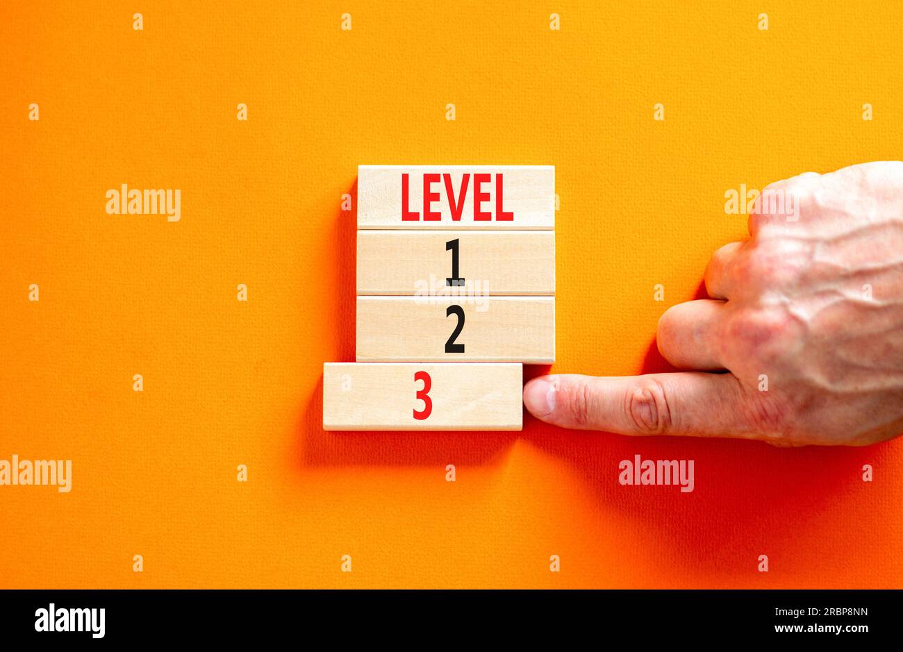 Time to level 3 symbol. Concept word Level 1 2 3 on wooden block ...