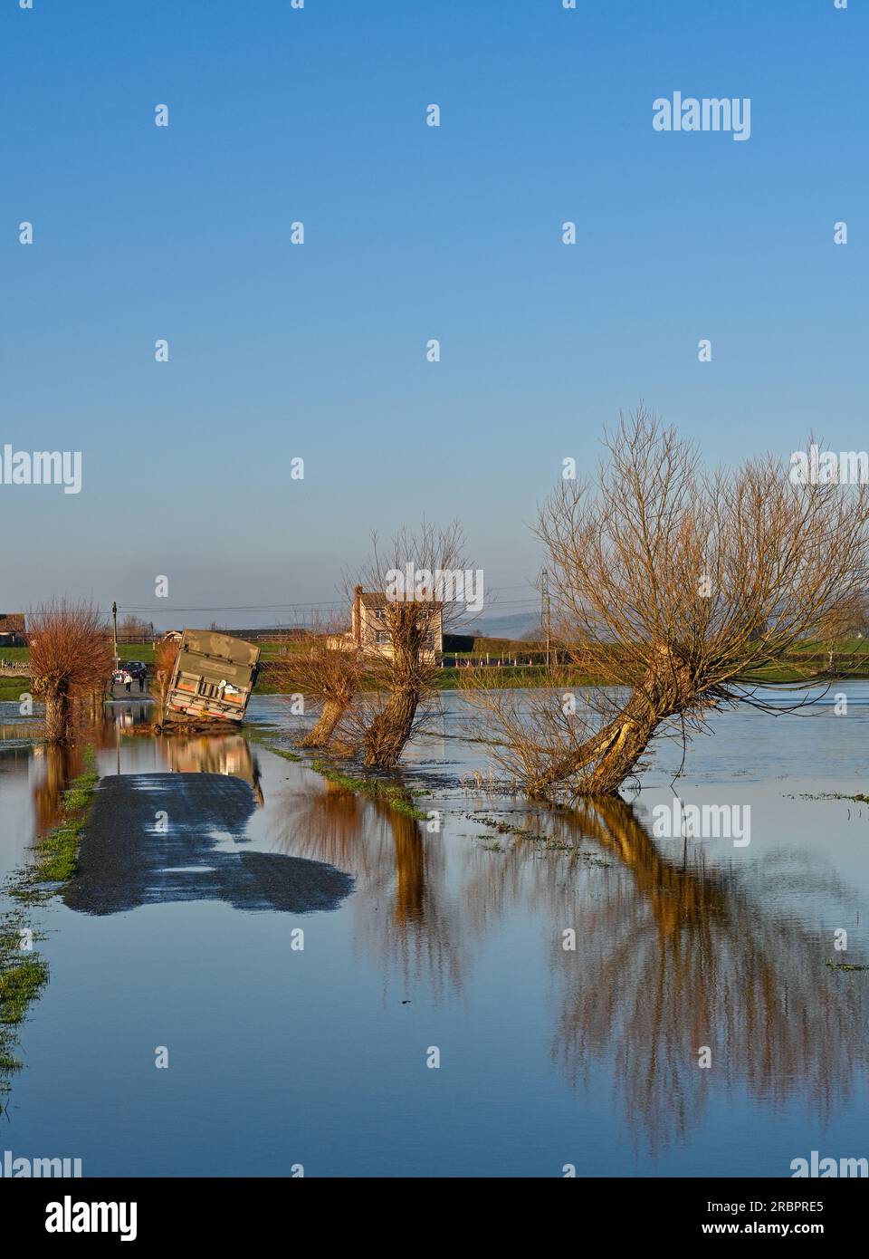 Stranded Lorry having driven off the road during flooding of the Somerset Levels at Godney near Glastonbury Somerset Stock Photo