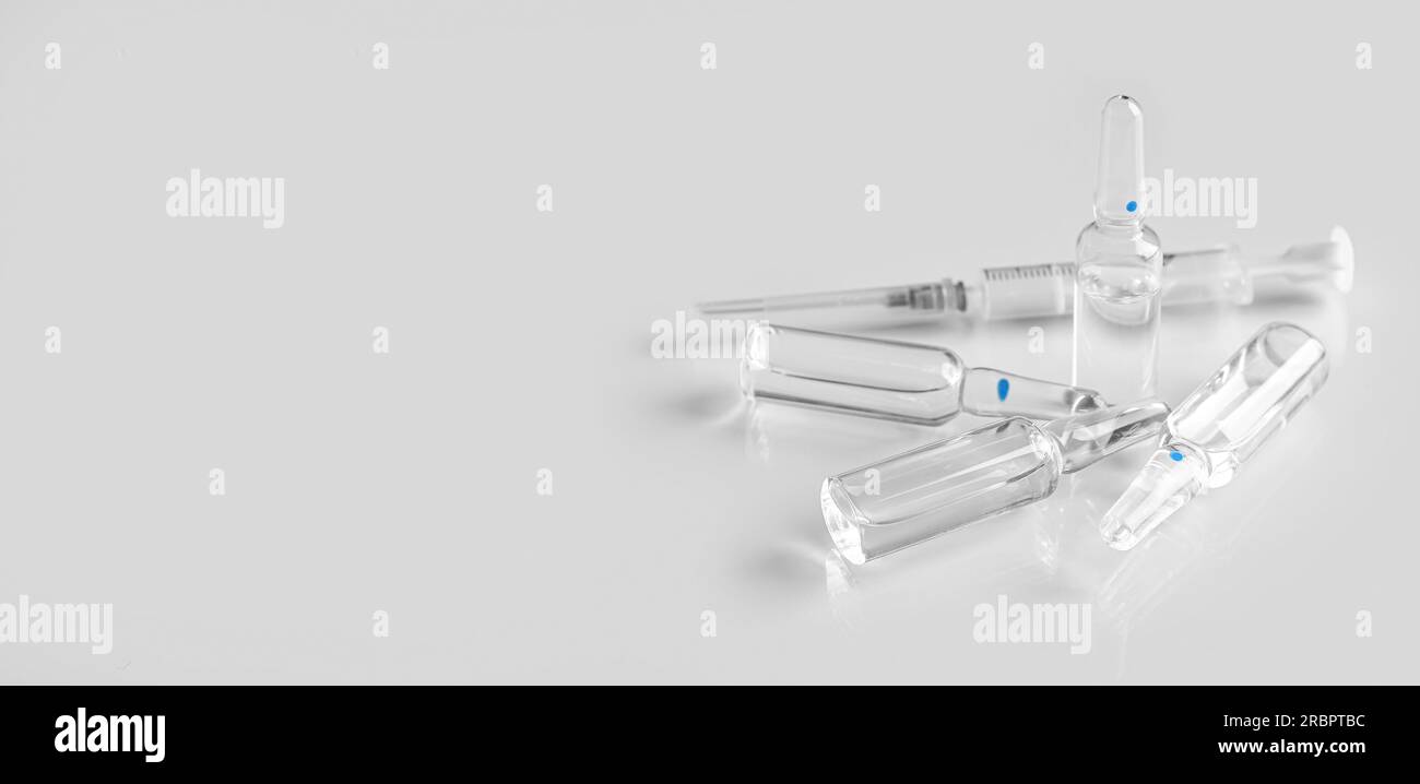 Medical ampules and syringe on light background with space for text Stock Photo Alamy